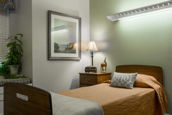 Cozy resident room with a bed and decorative elements