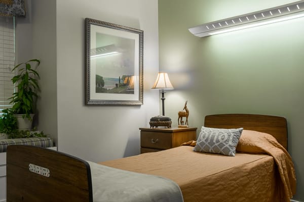 Cozy resident room with a bed and decorative elements