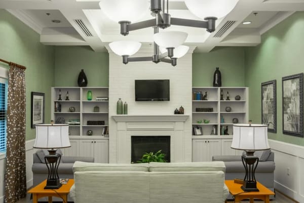 Cozy common area with sofas and lamps