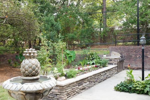 Garden area with fountain and lush greenery