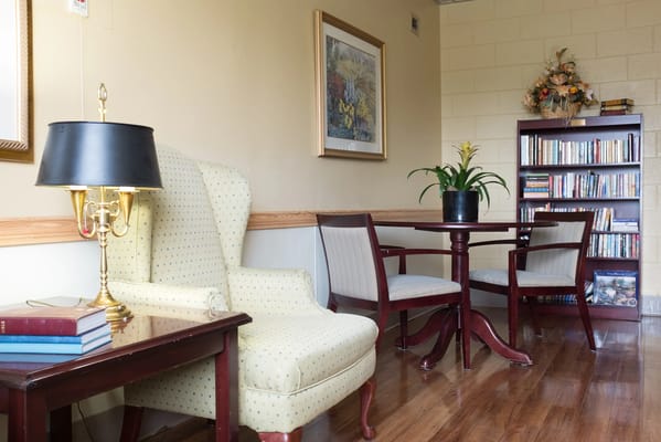 Cozy sitting area with chairs and bookshelves
