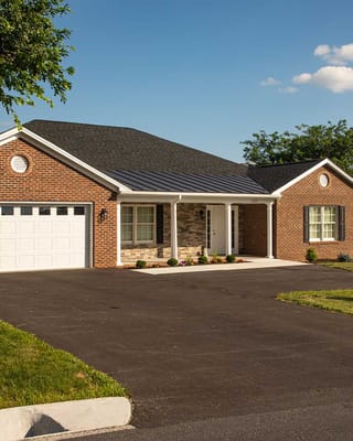 Exterior view of a residential building with landscaping