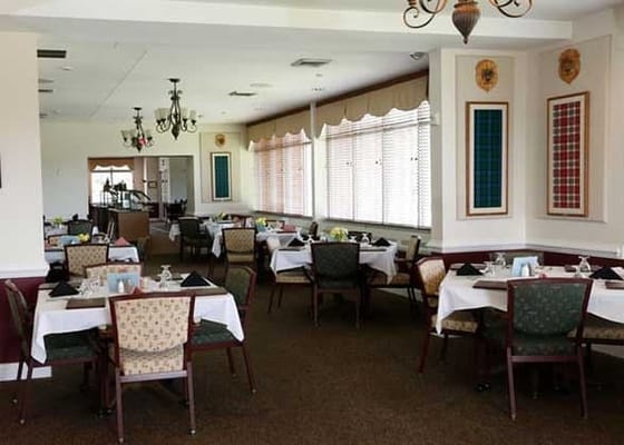 Dining room with tables set for meals