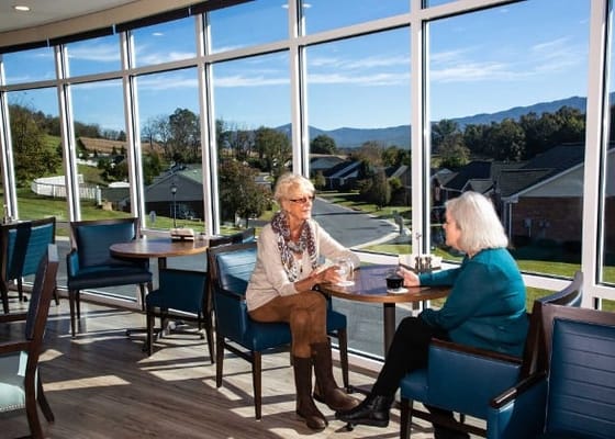 Residents enjoying conversation in a bright lounge