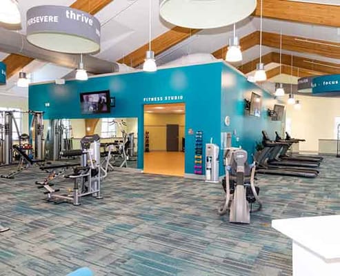 Bright fitness studio with gym equipment