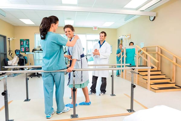 Therapist assisting a resident with rehabilitation exercises