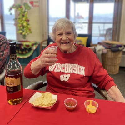 Resident enjoying snacks and drinks at a celebration