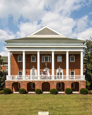 Exterior view of a senior living facility with columns