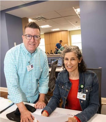 Staff interacting with residents at a facility's workspace