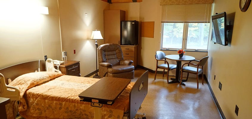 Cozy resident room with comfortable furniture and window view