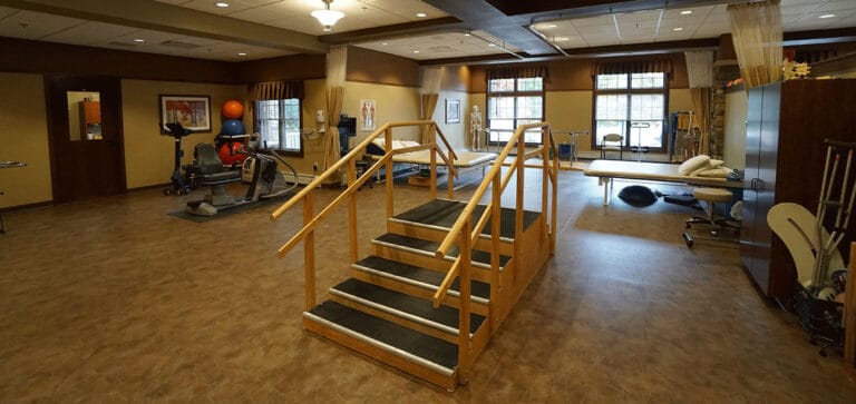 Therapy room with exercise equipment and stairs