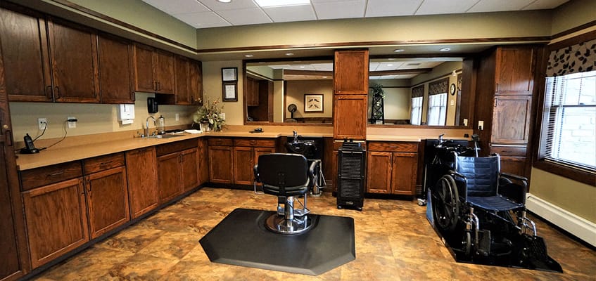 Interior view of a salon area with wheelchairs