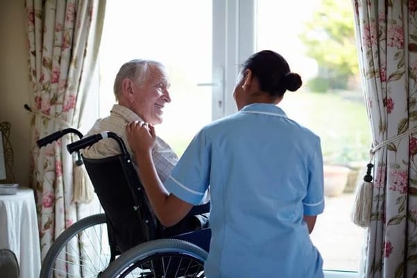Caregiver interacting with a resident in a cozy setting