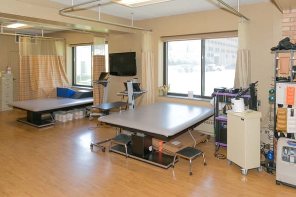 Therapy room with equipment and treatment tables