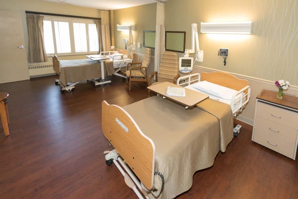 Private resident room with hospital beds and furnishings