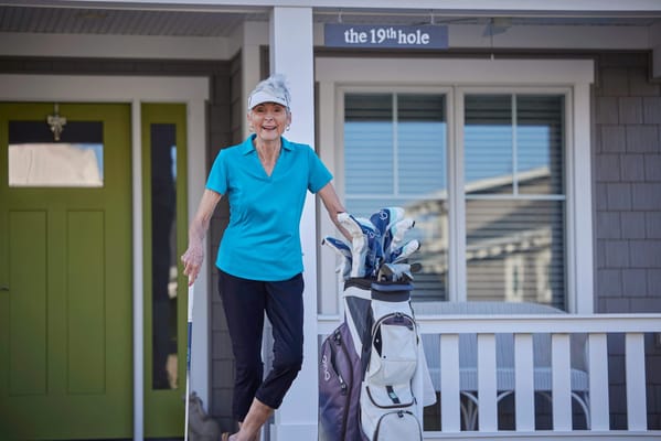 Resident enjoying golf activities outside a facility