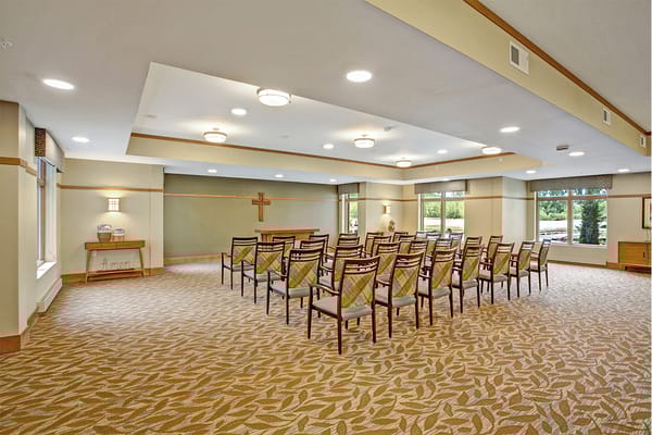 Interior view of a common area with chairs arranged for an event