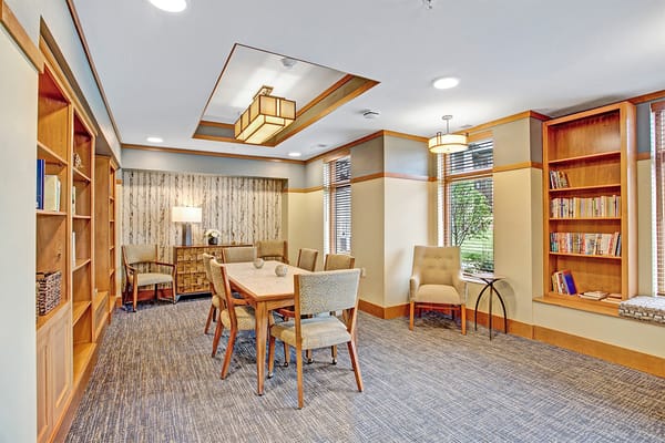 Cozy common area with seating and bookshelves