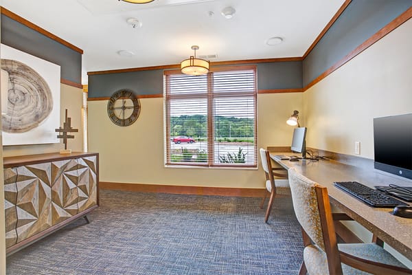 Interior view of a common area with seating and a computer