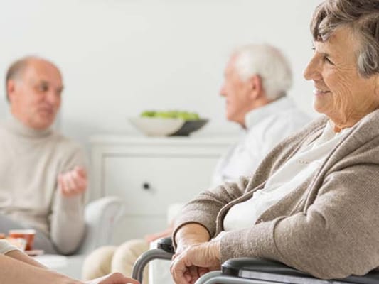 Residents engaging in conversation in a common area