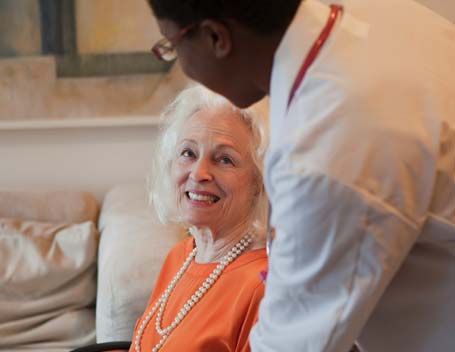 A caregiver interacting with a senior resident