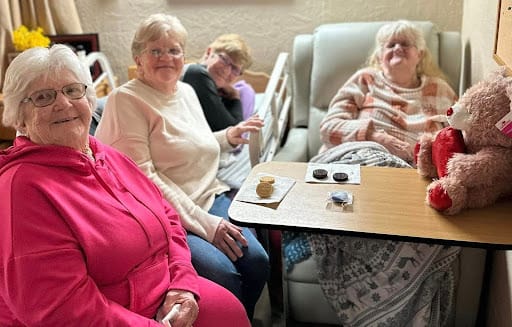 Residents enjoying time together in a cozy lounge