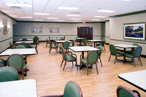 Bright, spacious dining area with tables and chairs