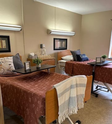 A cozy shared resident room with two beds
