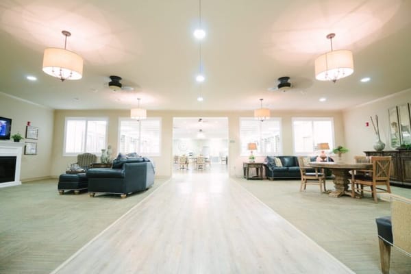 Bright common area with seating and warm lighting