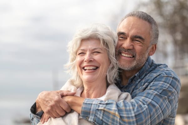 Two happy seniors enjoying time together outdoors