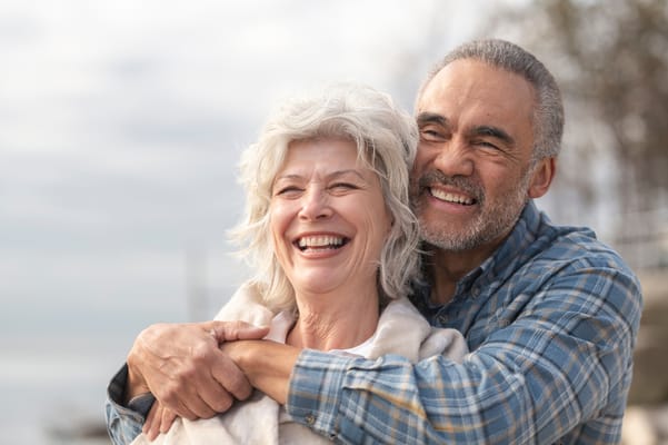 Two happy seniors enjoying time together outdoors