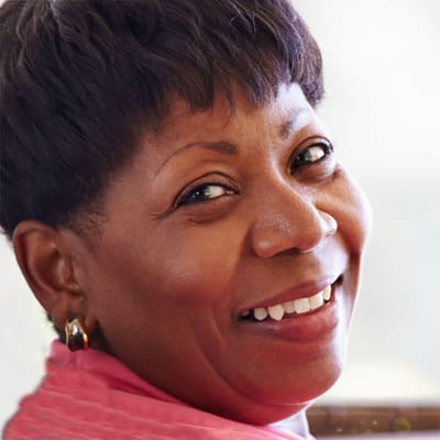 Smiling resident in a vibrant indoor setting
