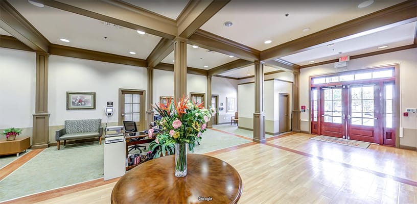 Interior view of a welcoming lobby area with flowers
