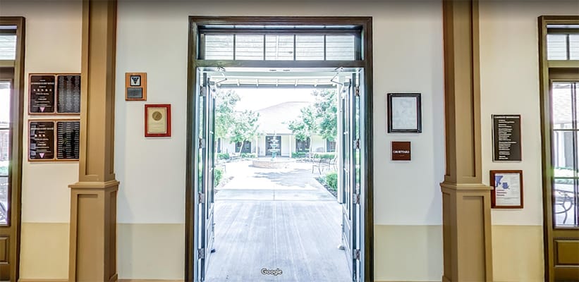 Entrance view to a courtyard from inside the facility