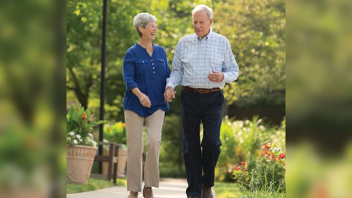 Couple walking together in a beautiful outdoor setting