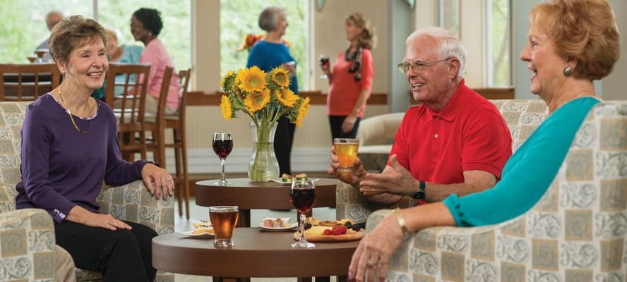 Residents enjoying drinks and snacks in a common area