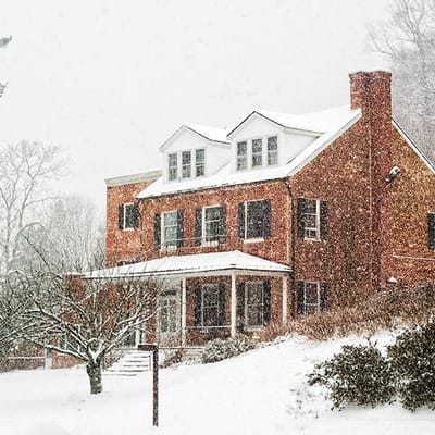 Exterior view of a senior living facility in winter