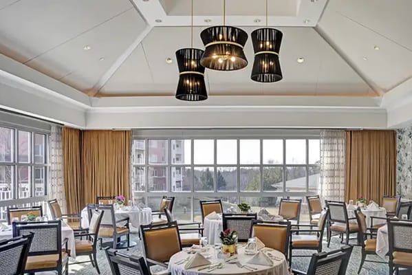 Interior view of a dining room with tables and chairs