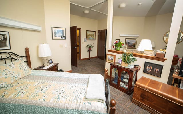 Cozy private room with a bed, decor, and personal items