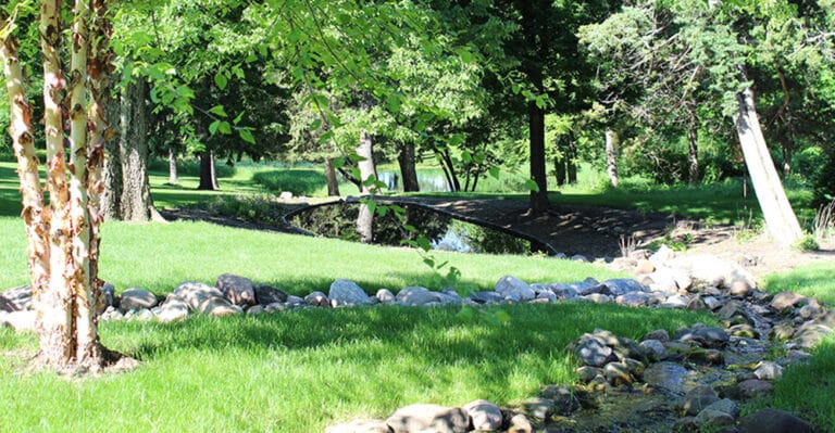 Scenic view of a serene outdoor area with a pond