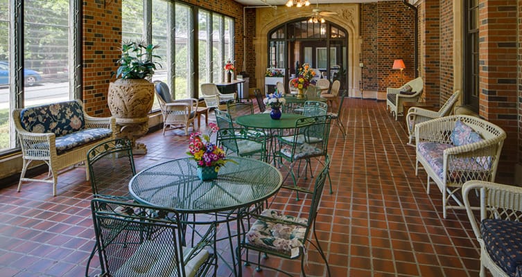 Bright common area with seating and flower arrangements