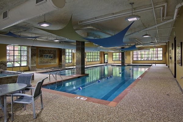 Indoor pool area with seating and swim lanes