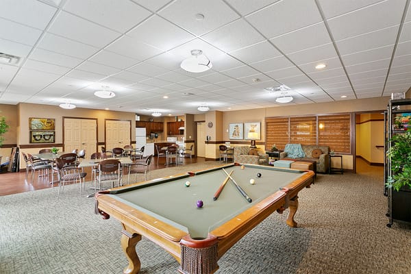 Common area with a pool table and seating