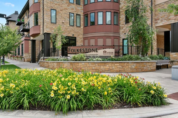 Exterior view of Folkestone with landscaped flowers