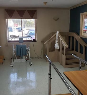 Rehabilitation area with exercise equipment and stairs