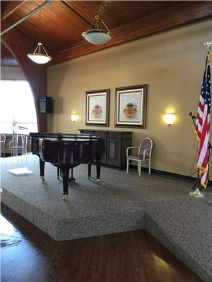 Interior view of a common area with a grand piano