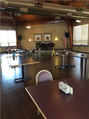Interior view of a dining area with tables and chairs