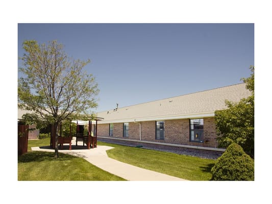 Exterior view of Brookside Inn with landscaping