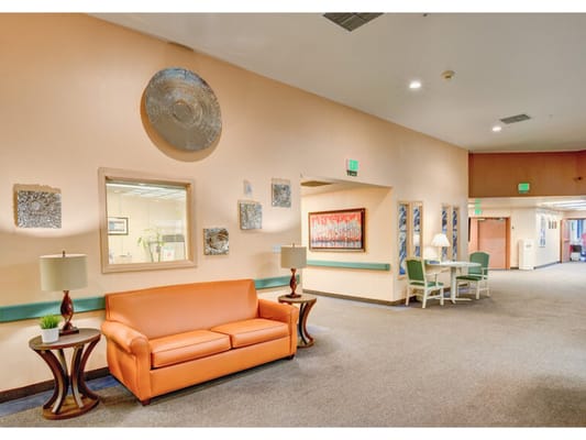 Common area with seating and art on the walls