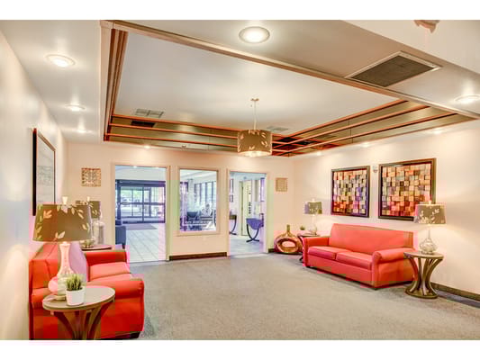 Interior view of a common area with red seating